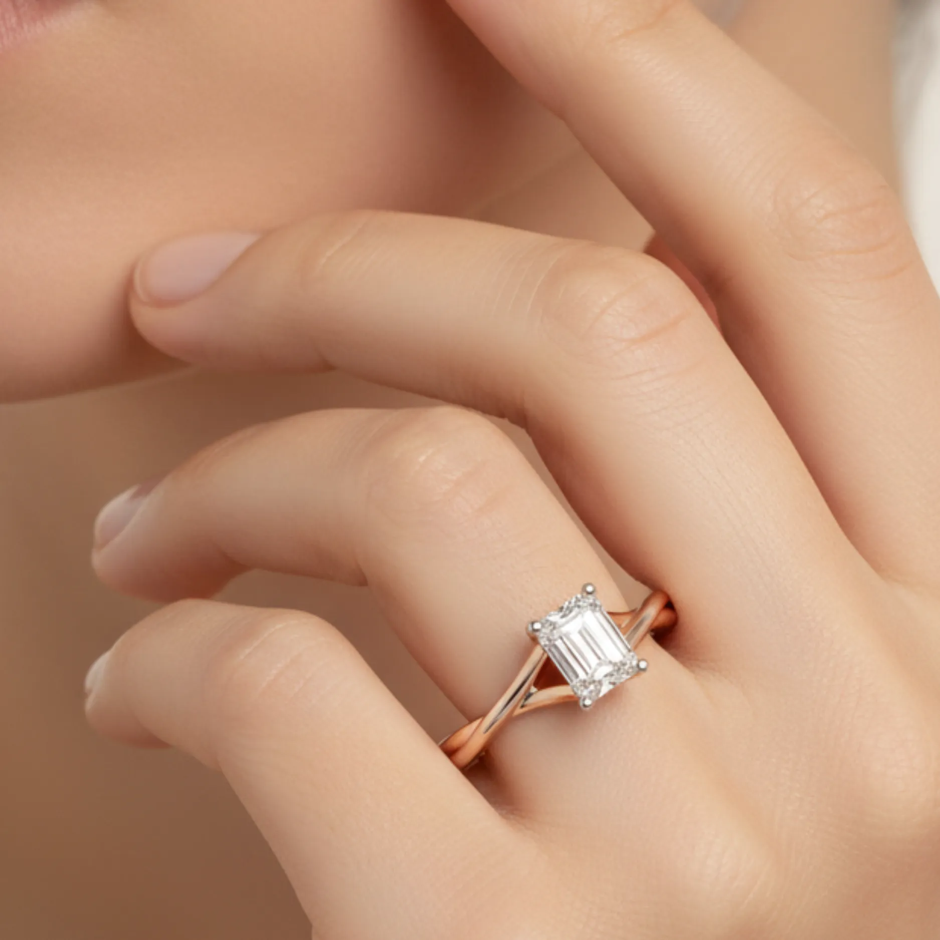 Intertwined Emerald Solitaire Ring